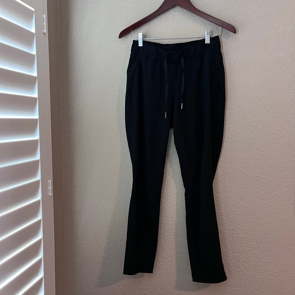 Lululemon On The Fly Black Pants Size 4 Women’s Elastic Waist Side Pockets - Picture 4 of 7